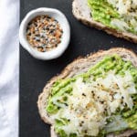 avocado toast with sauerkraut and a bowl of everything but the bagel seasoning