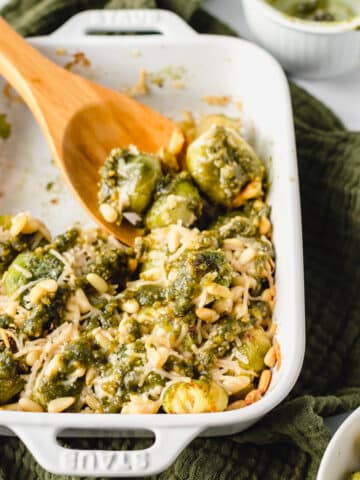 smashed Brussels sprouts topped with parmesan, pine nuts and pesto