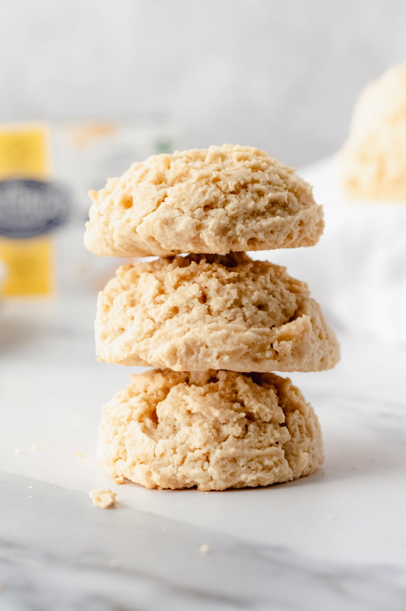 3 vegan gluten free drop biscuits stacked on top of eachother