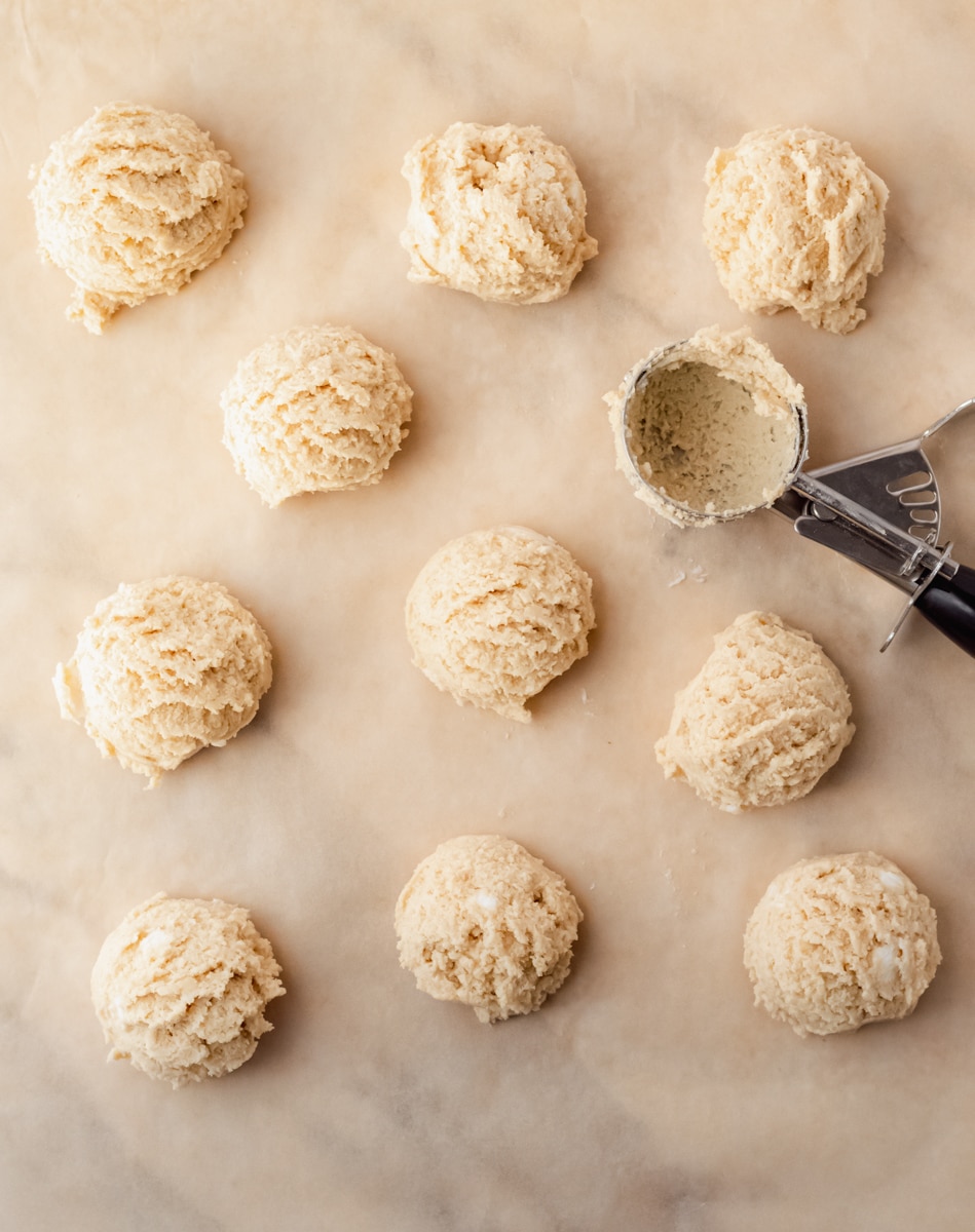 biscuits scooped on parchment paper