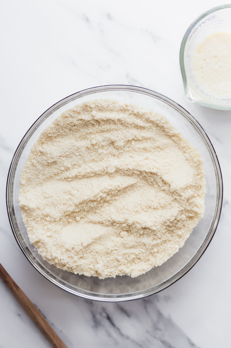 almond flour, oat flour, sugar, baking powder and salt combined in a glass mixing bowl