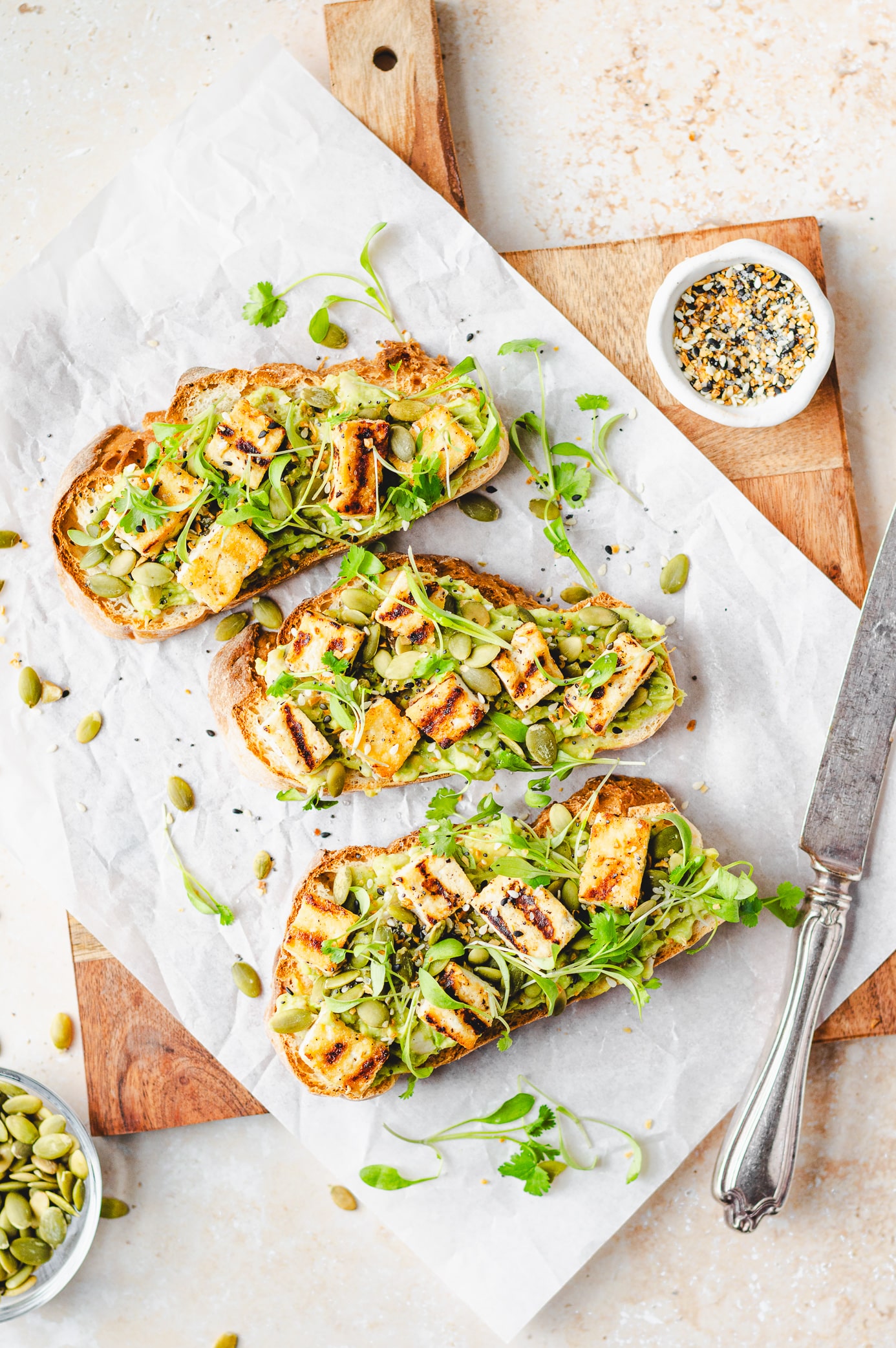 loaded high protein avocado toast with grilled tofu and white beans