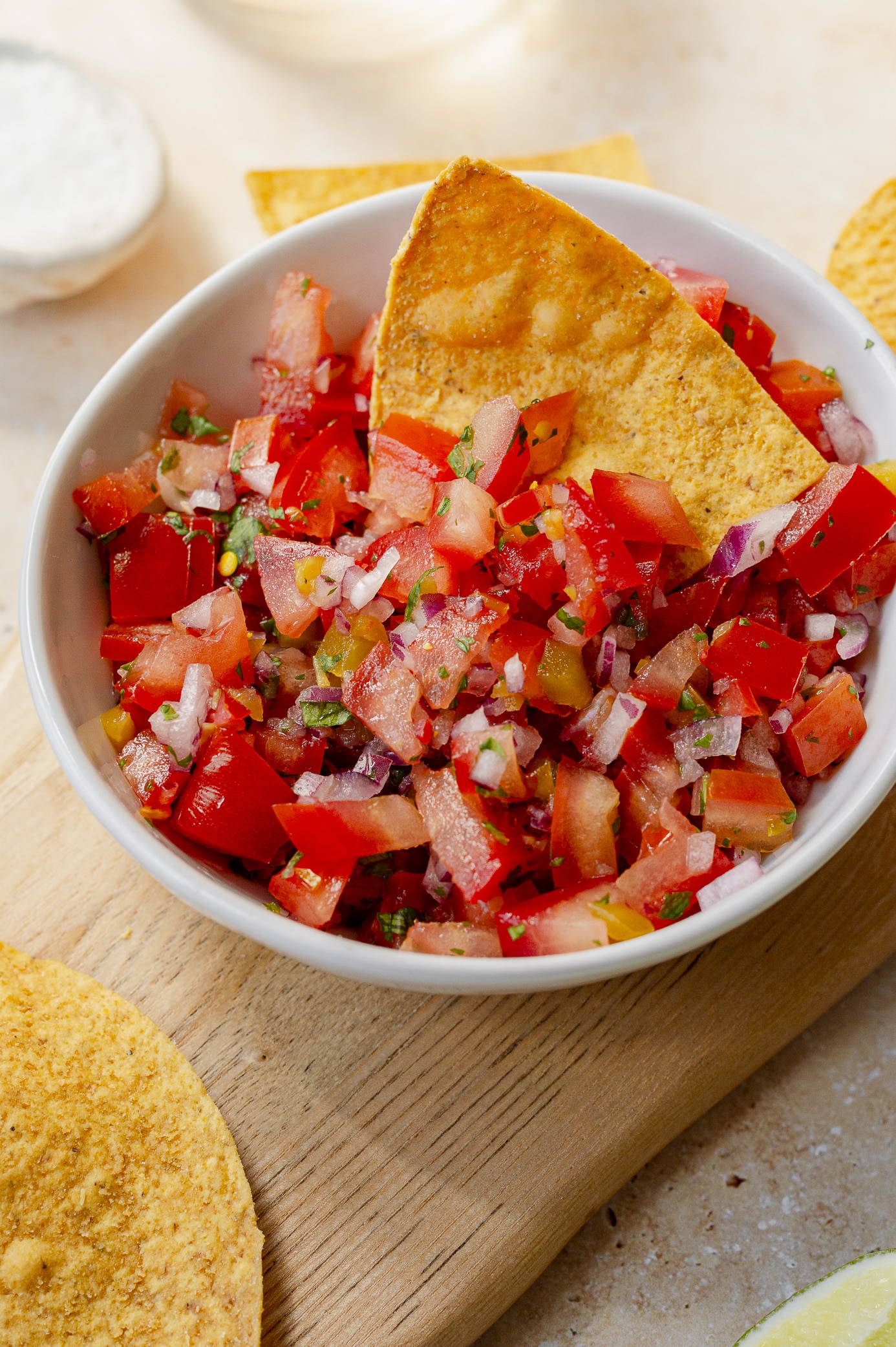 Overhead view of fresh tomato salsa with tortilla chips