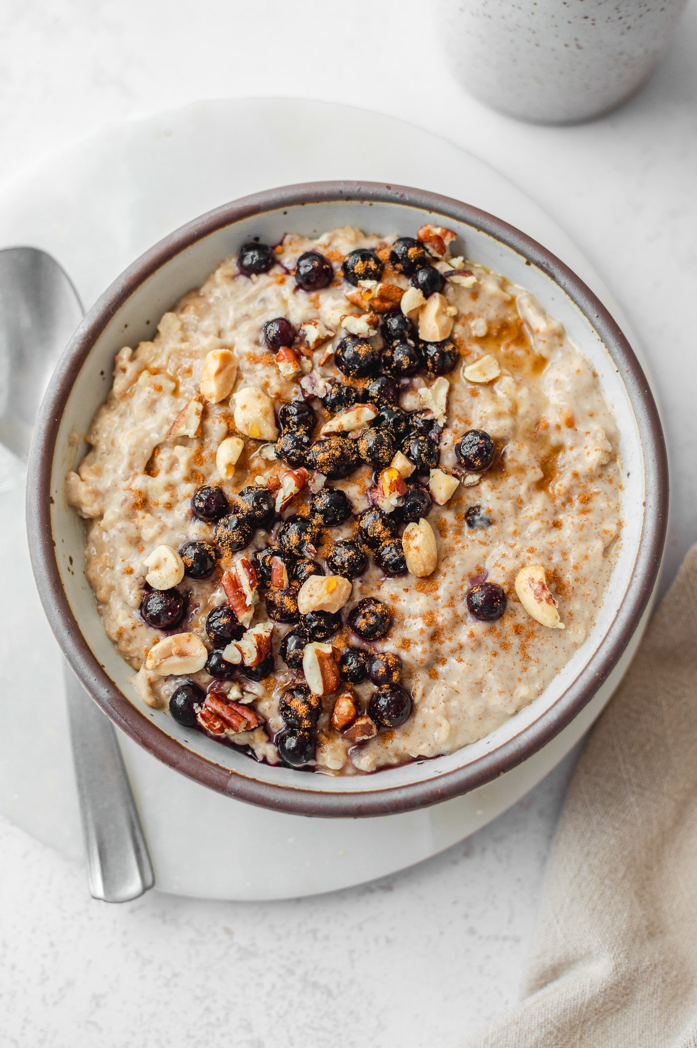 5-minute creamy oatmeal with peanut butter and frozen blueberries