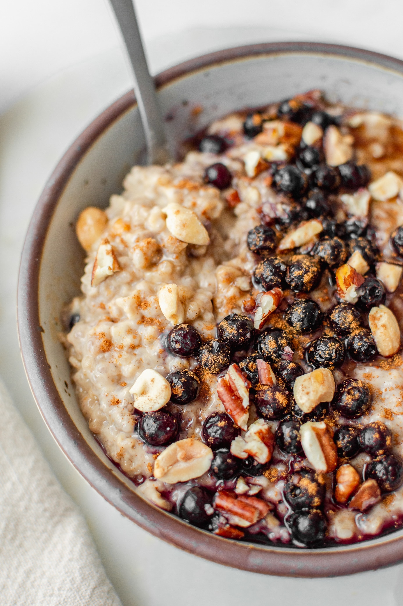 Close-up of thick stovetop peanut butter oatmeal made with quick oats