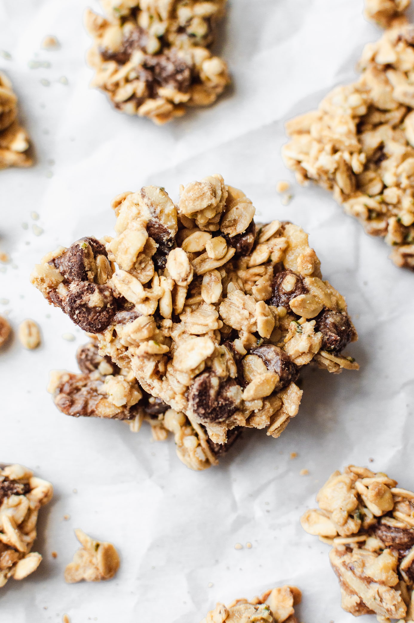 Large chocolate chip cookie dough granola cluster showing crunchy oats and chocolate chunks.