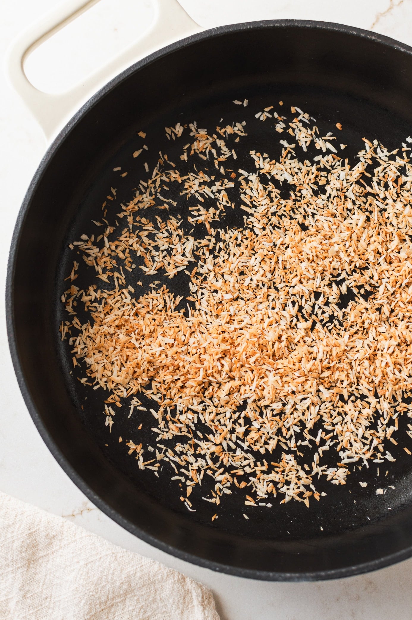 toasted coconut shreds in a skillet
